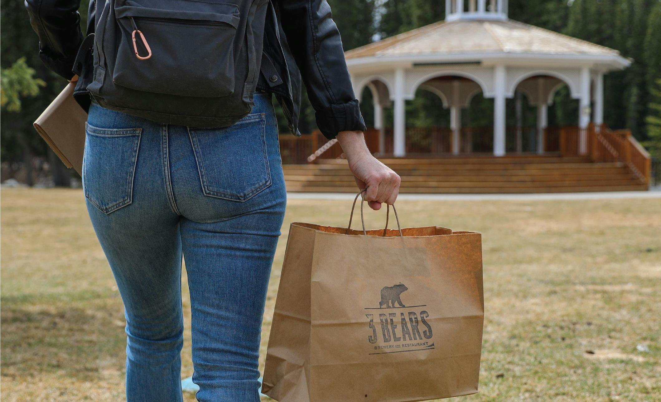Arriving to Central Park with a Three Bears Brewery and Restaurant takeout bag