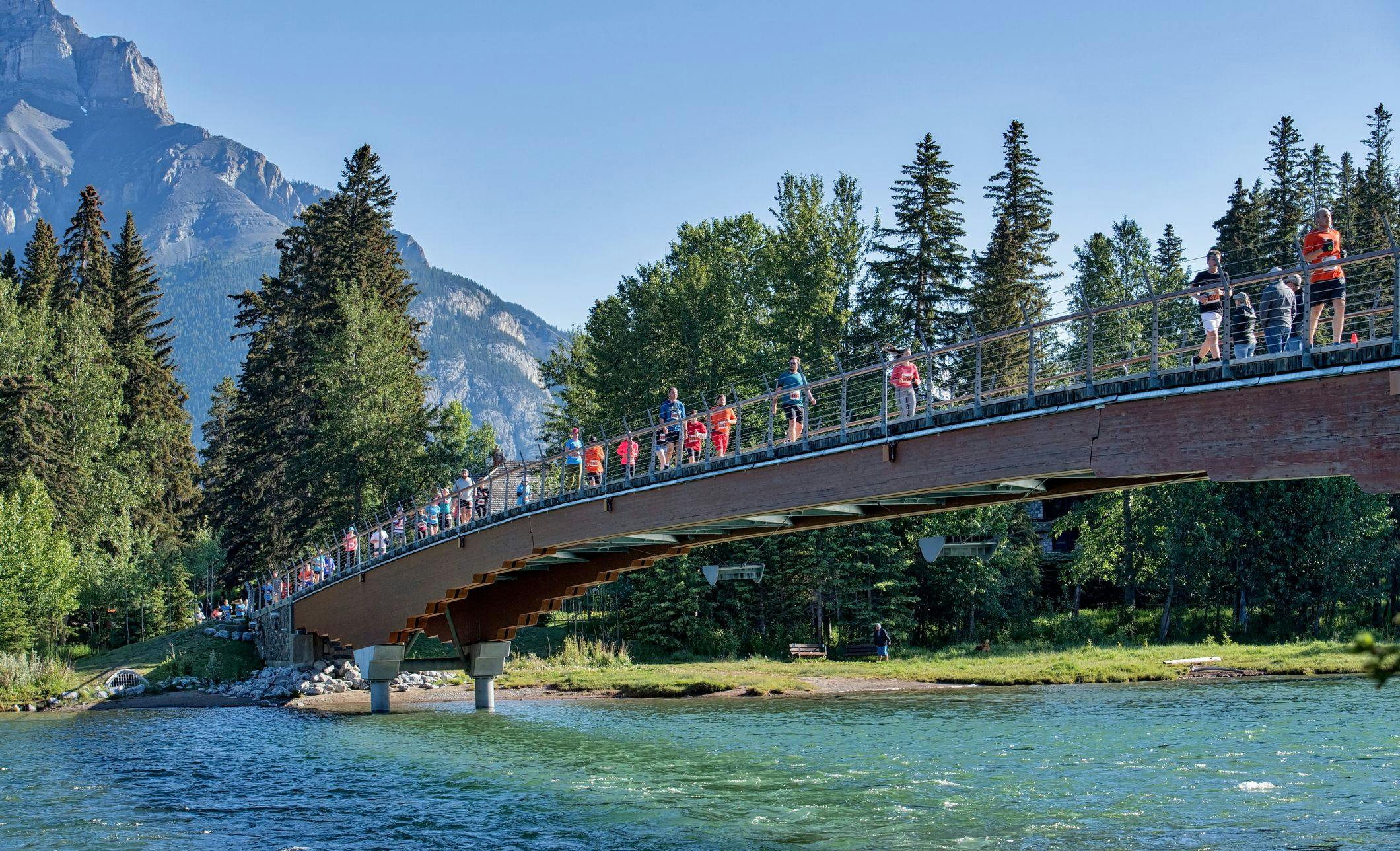 Running along the Banff pedestrian bridge
