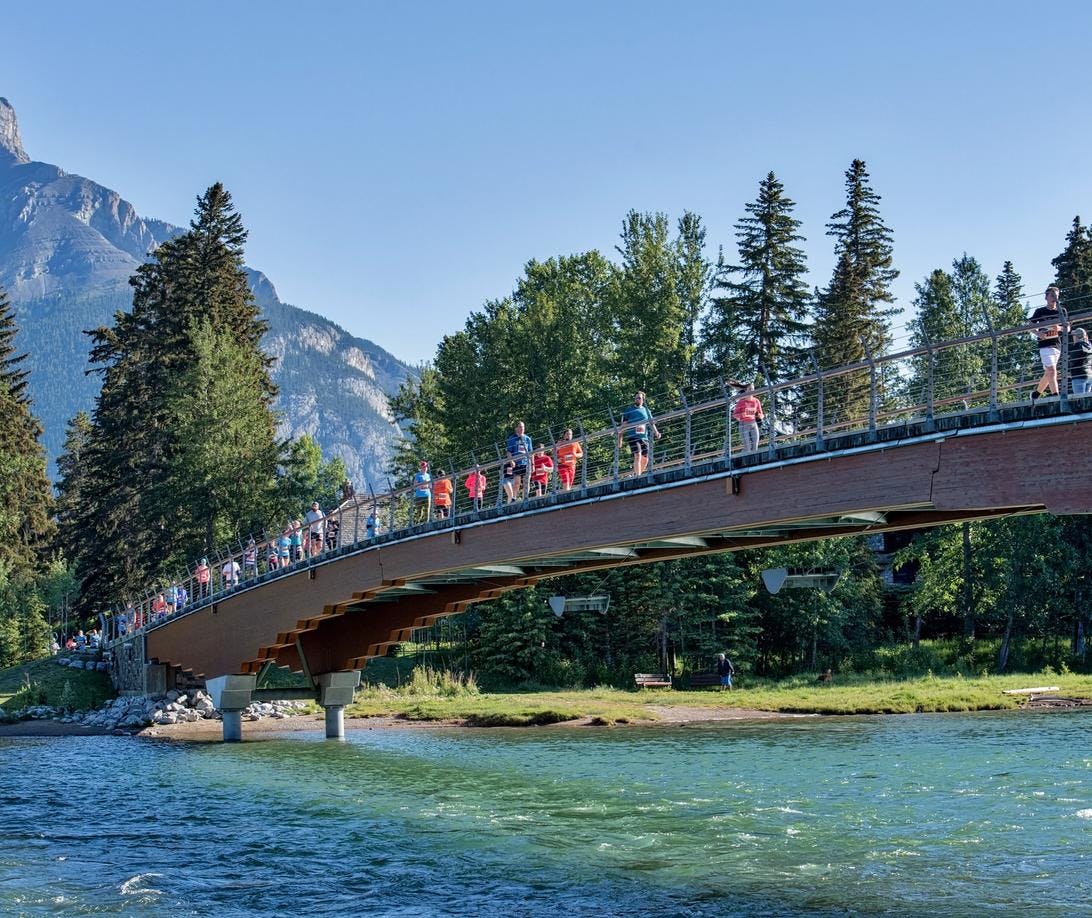 Running along the Banff pedestrian bridge