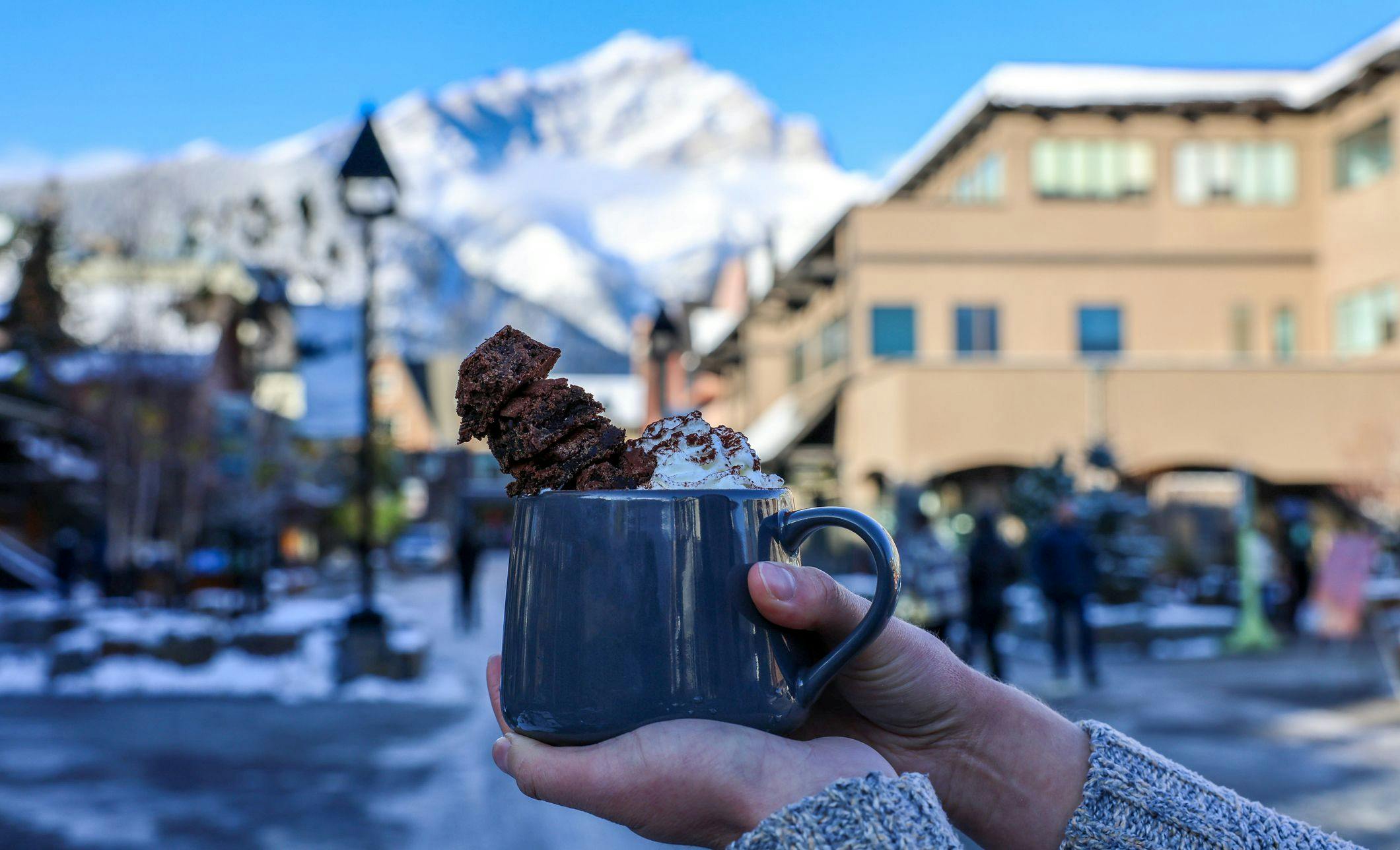 A hot chocolate on Bear Street with Cascade Mountain in the background.
