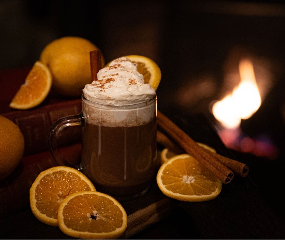 A hot chocolate surrounded by oranges from St. James Gate.