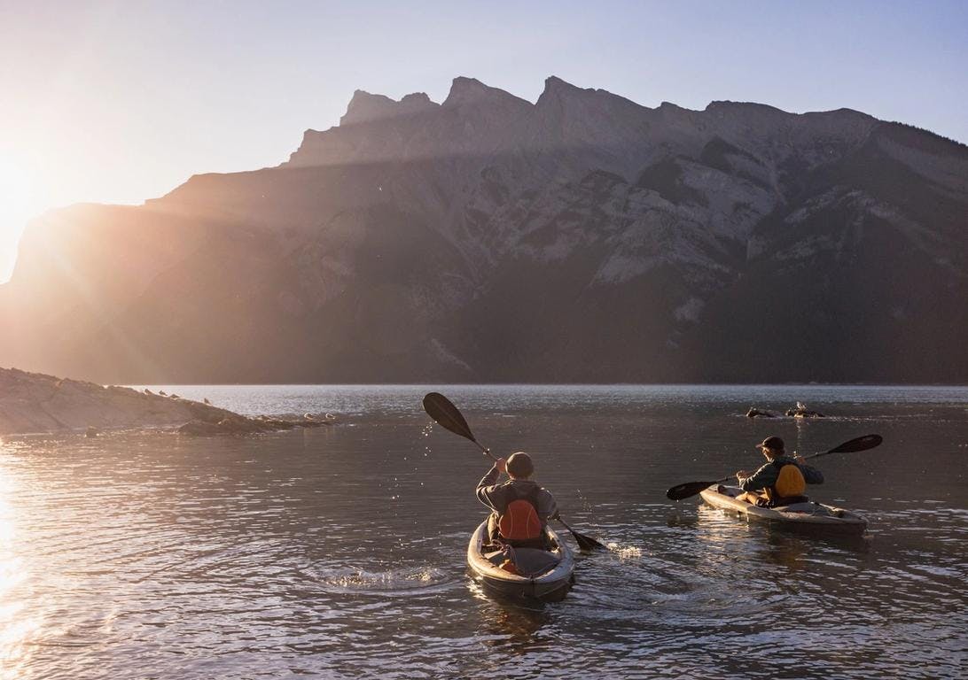 Two kayaks explore Lake Minnewanka in Banff National Park in the Canadian Rockies.