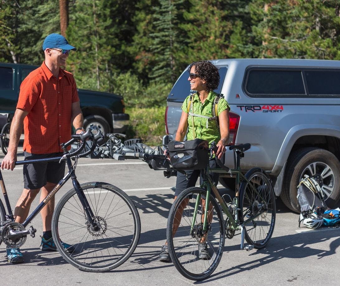 Two cyclists get ready for their bike ride on the Bow Valley Parkway at the Johnston Canyon 2 Parking Lot