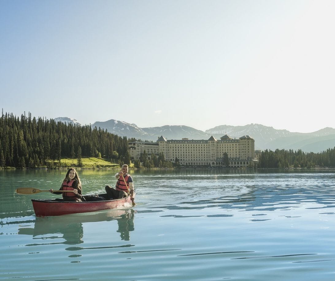 Two friends canoeing on Lake Louise