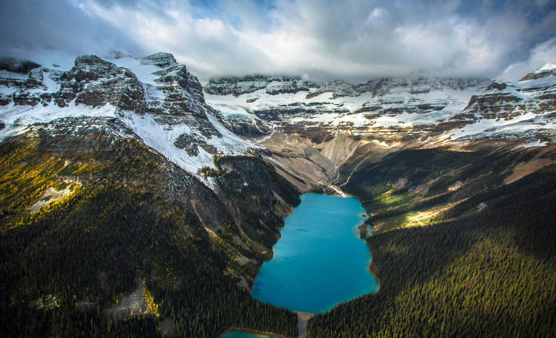 Alpine Helicopters flying over Lake Louise in the Fall