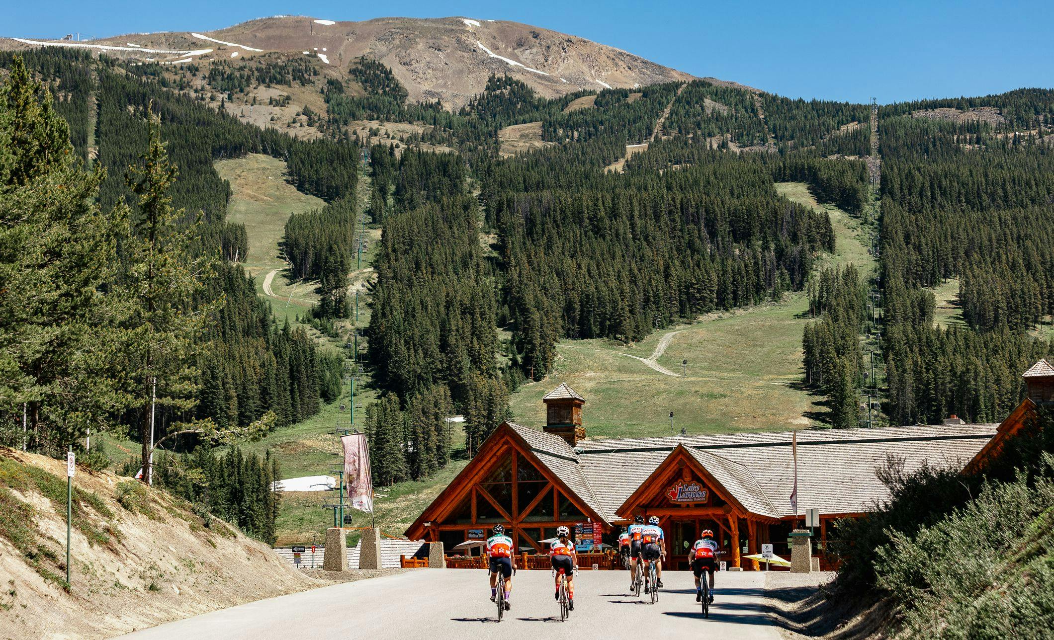 Cyclists ride into the Lake Louise Ski Resort after completing the Parkway to Pint ride.