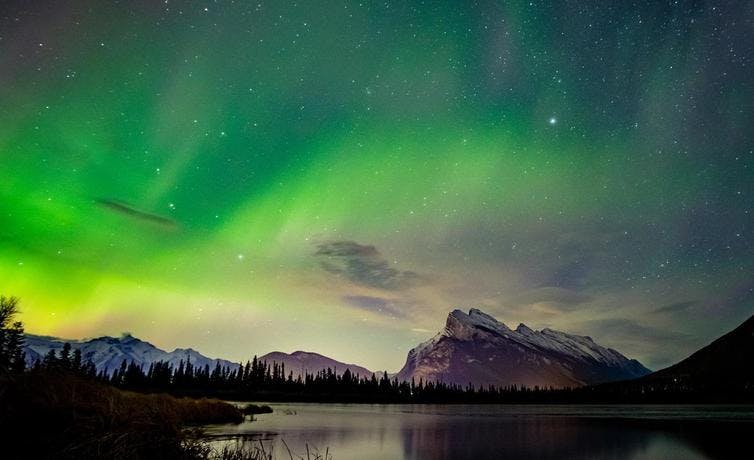 The northern lights over Vermilion Lakes and Mount Rundle in Banff National Park.