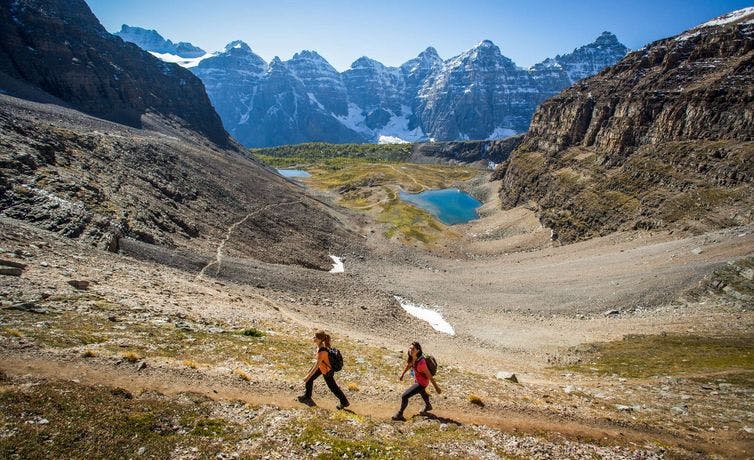 Hikers explore the stunning Sentinel Pass outside of Moraine Lake, AB.