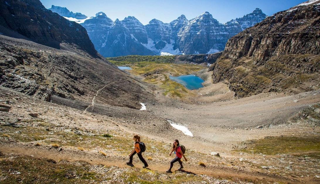 Hikers explore the stunning Sentinel Pass outside of Moraine Lake, AB.