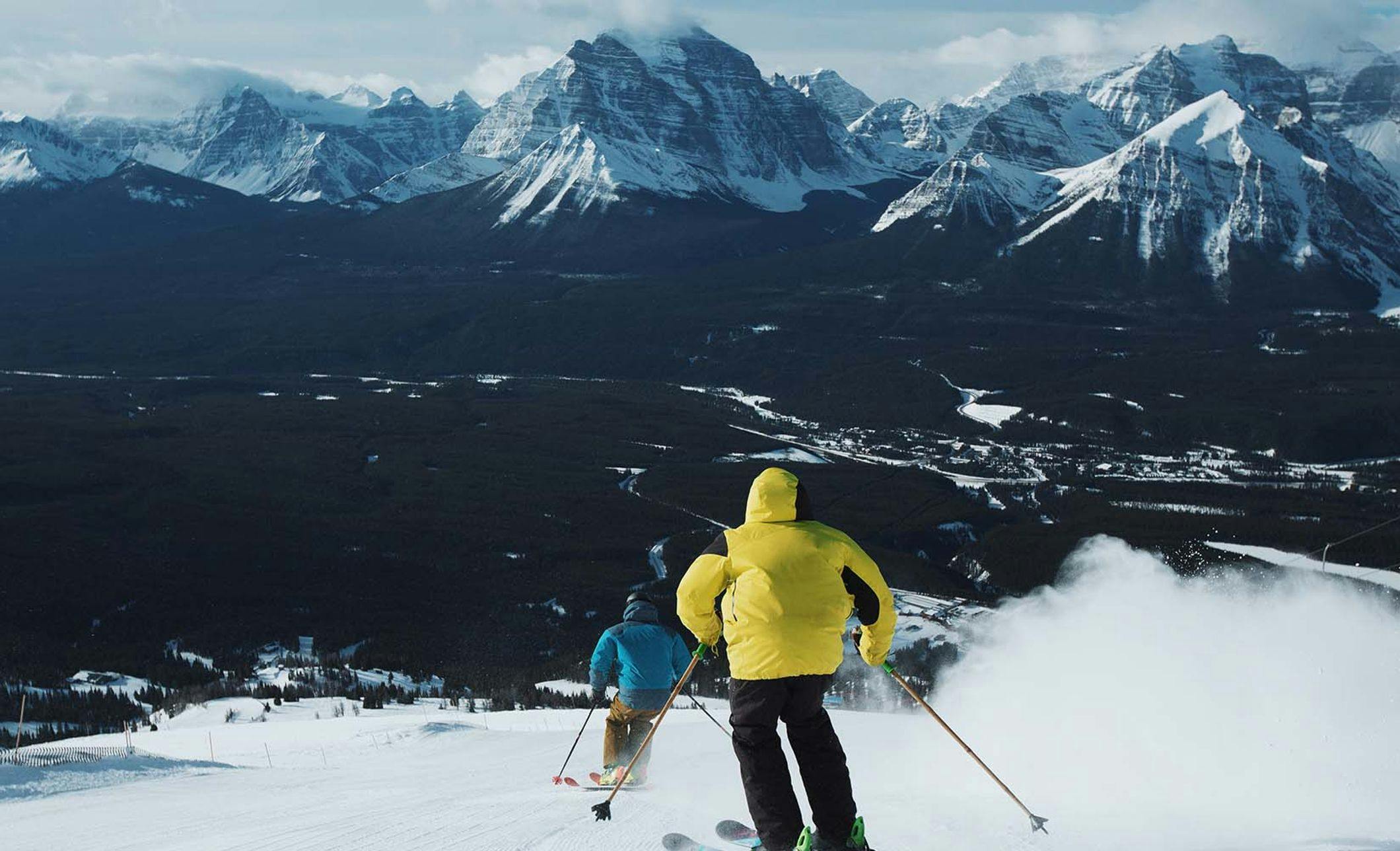 Two people ski down a run at the Lake Louise Ski Resort in Banff National Park.