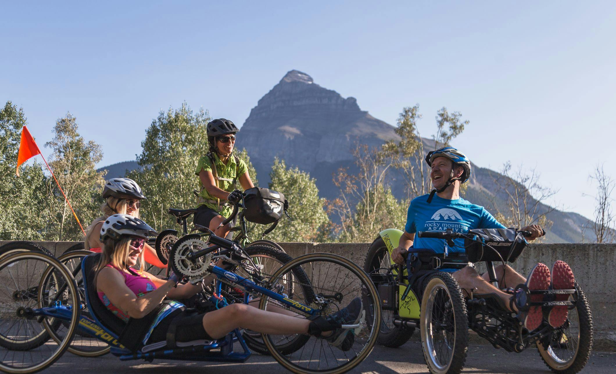 A group of bike riders stop at the Pilot Mountain viewpoint on the Bow Valley Parkway during the road closure.
