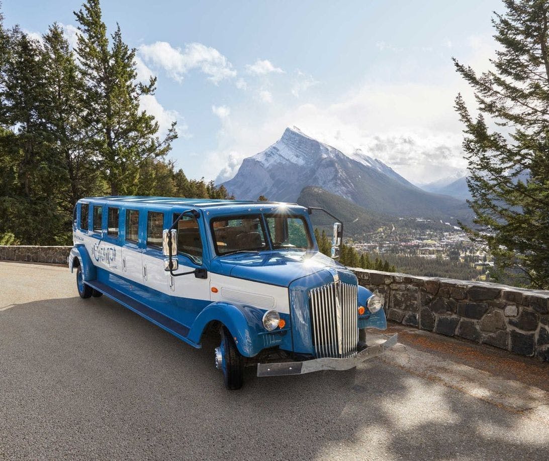 Pursuit&#039;s Open Top Touring bus sits on the Mt. Norquay viewpoint in Banff National Park