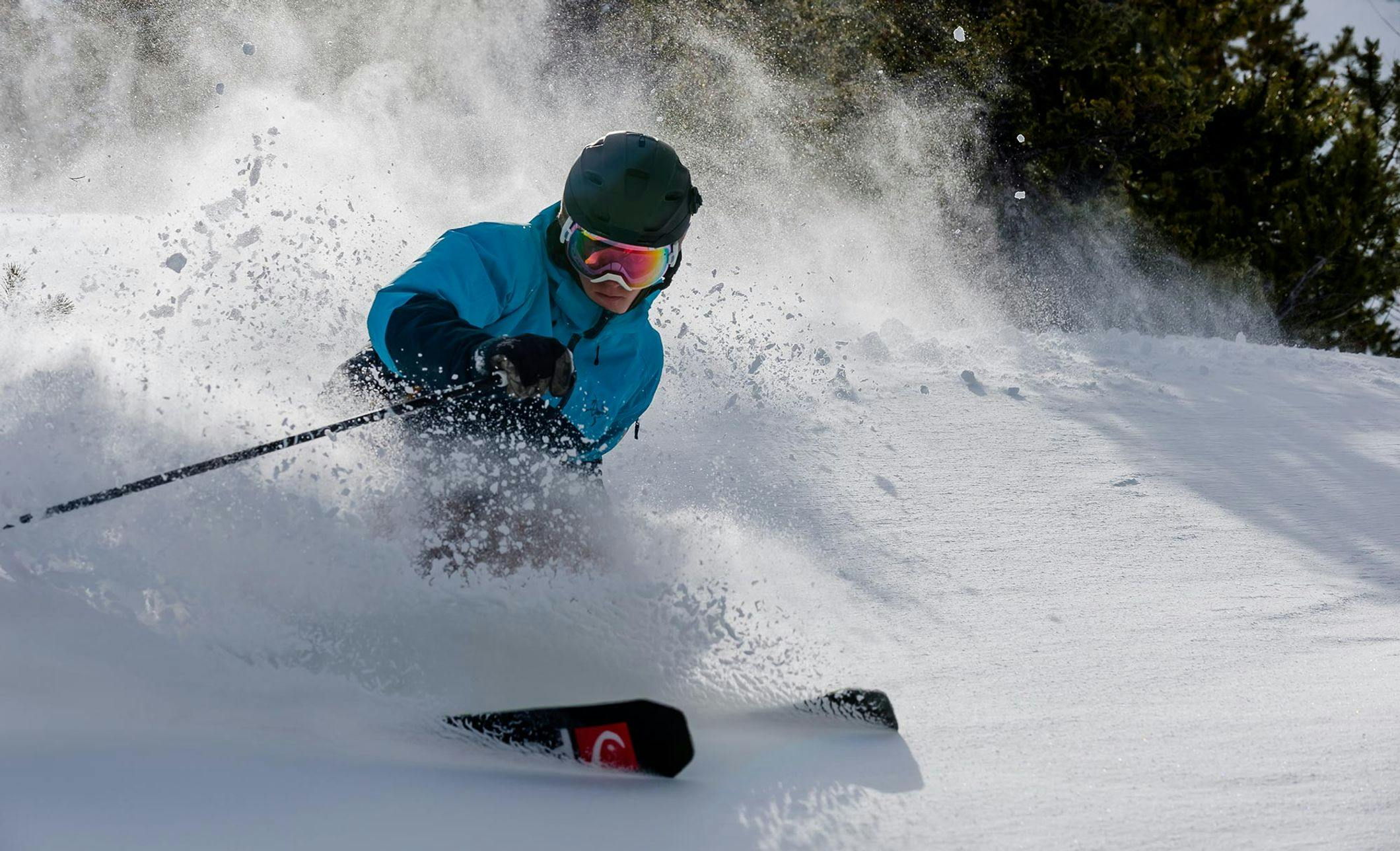 A skier makes a powder turn at the Mt. Norquay ski resort, Banff, AB